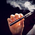 inhaling from an electronic cigarette.