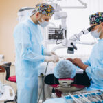Dentist with patient at a visit